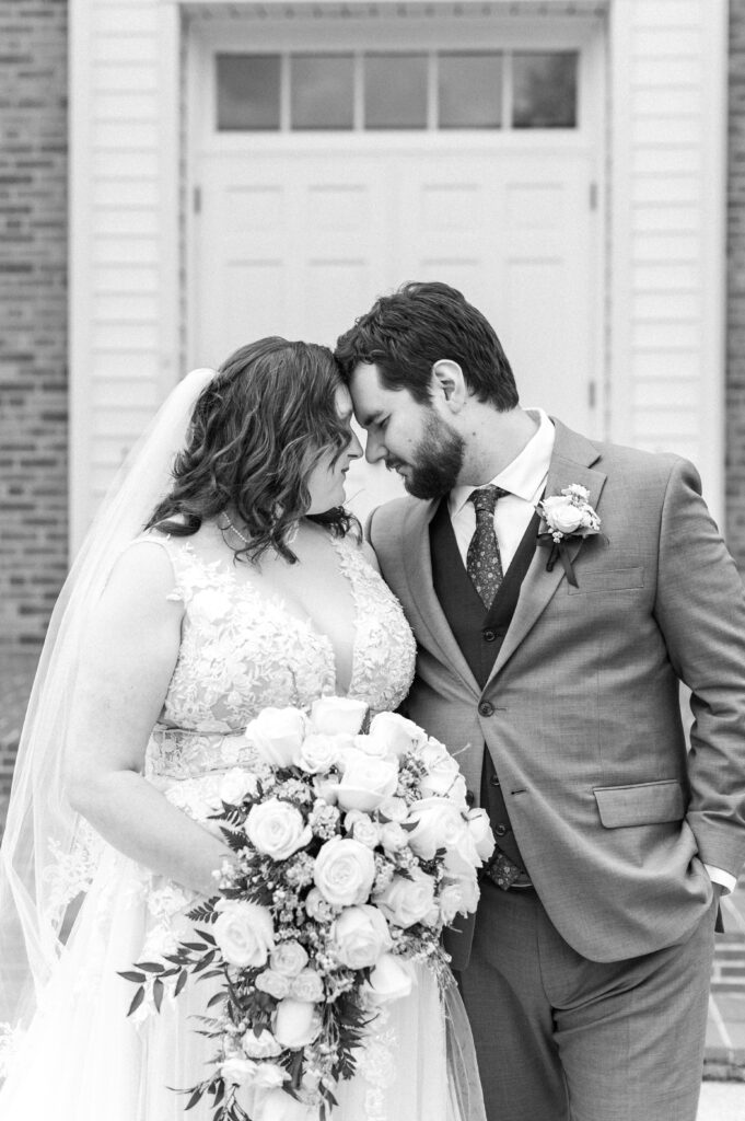 bride and groom touching foreheads