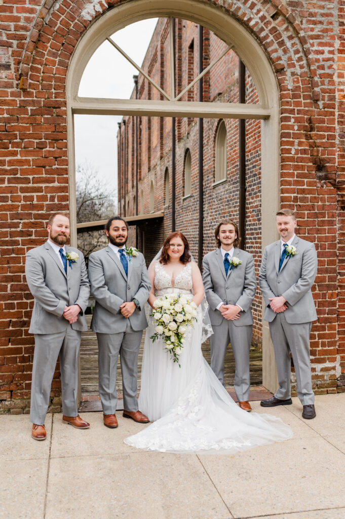 bride with groomsmen