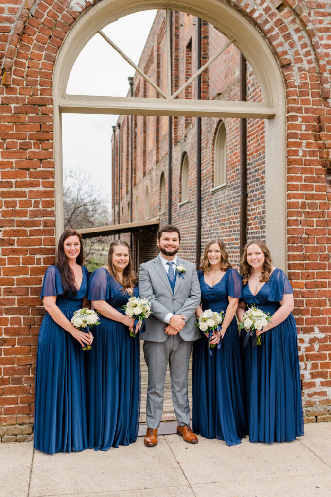 groom with bridesmaids