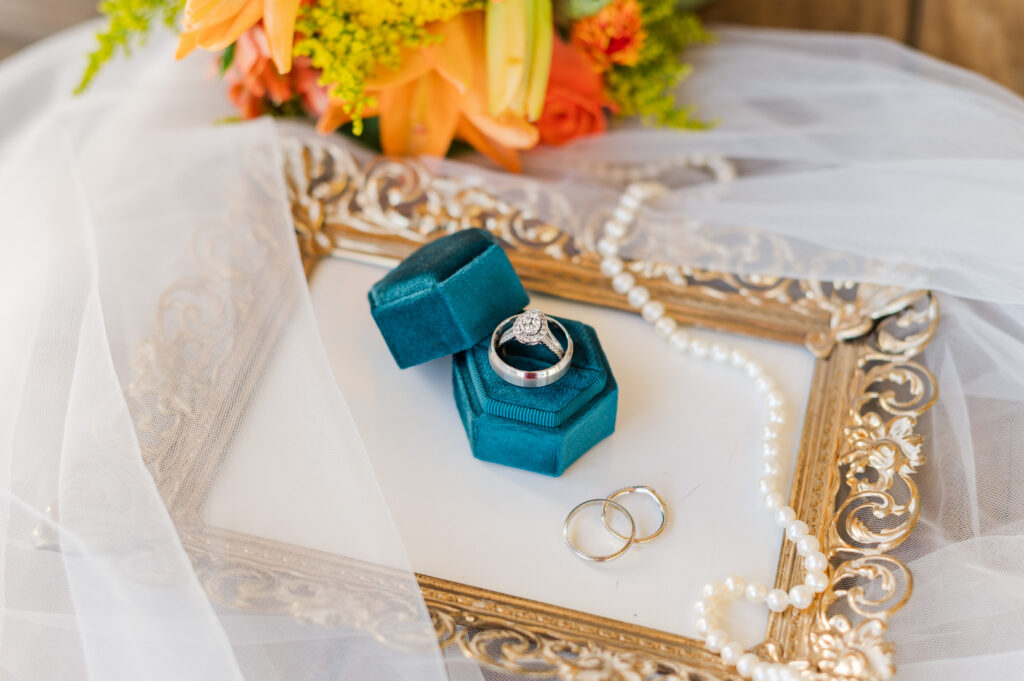 detail of rings, jewelry, and wedding veil