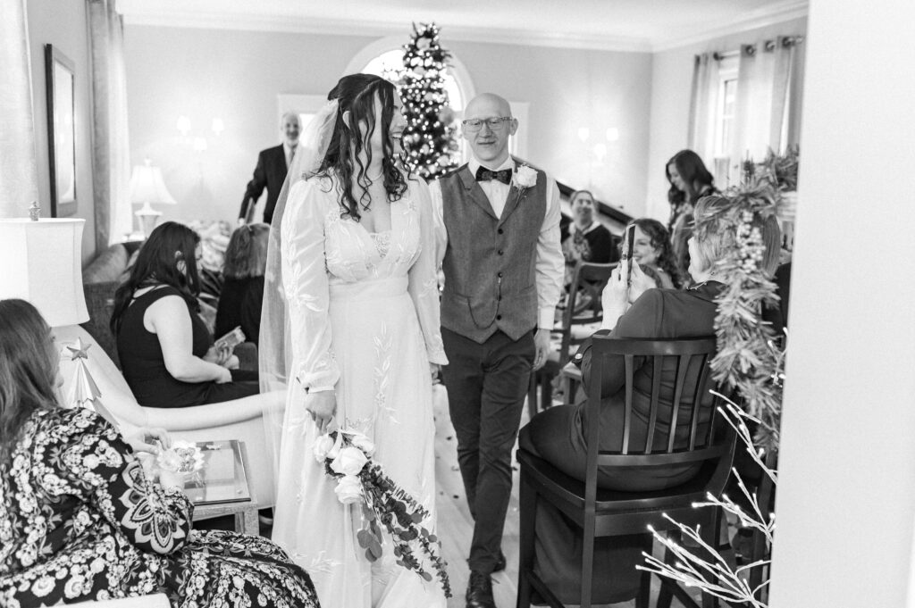 bride and groom walk down aisle