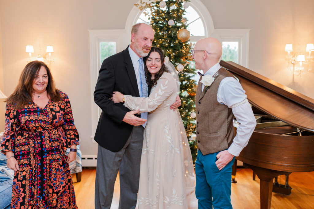 bride hugs wedding guest