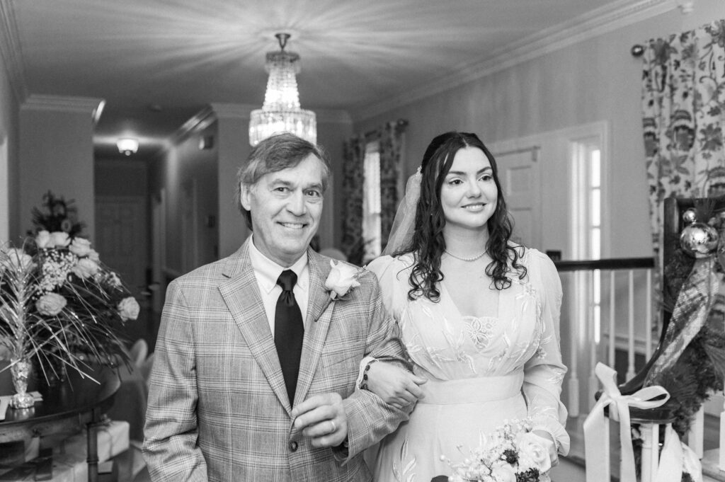 father of the bride walks bride down aisle