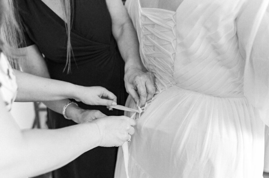 lacing up bride's dress