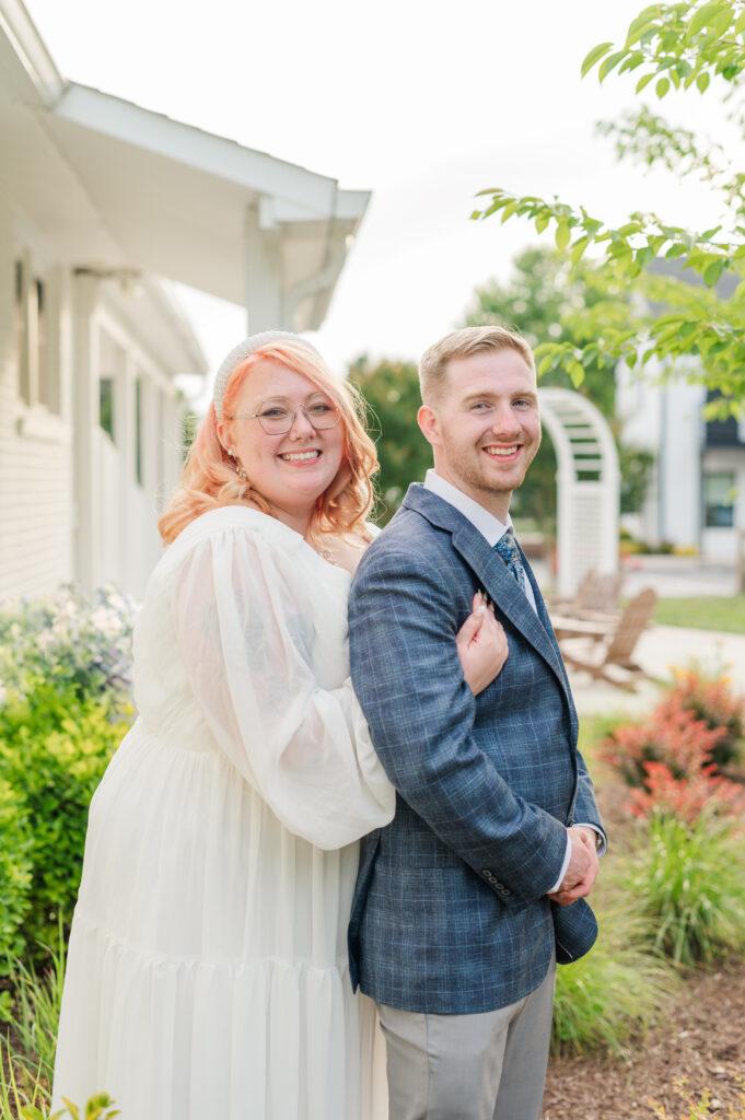 bride and groom smiling at camera