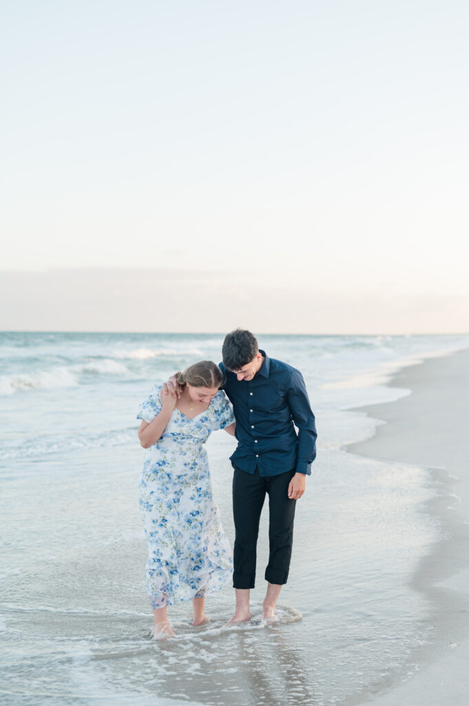 couple walking at topsail beach