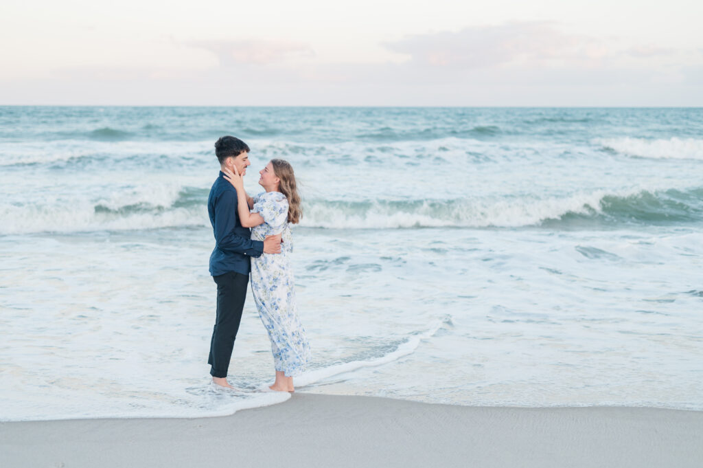 couple in waves at topsail beach