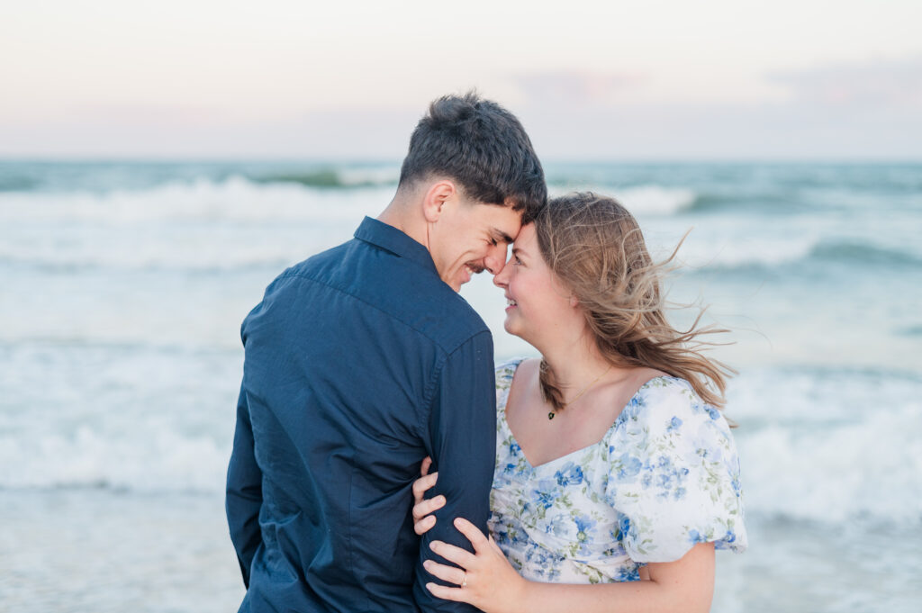 couple smiling at each other at topsail beach