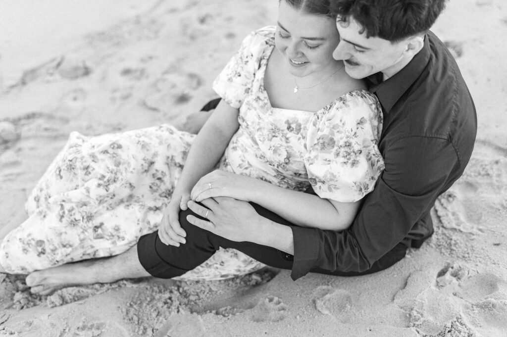 couple looking at wedding rings at topsail beach