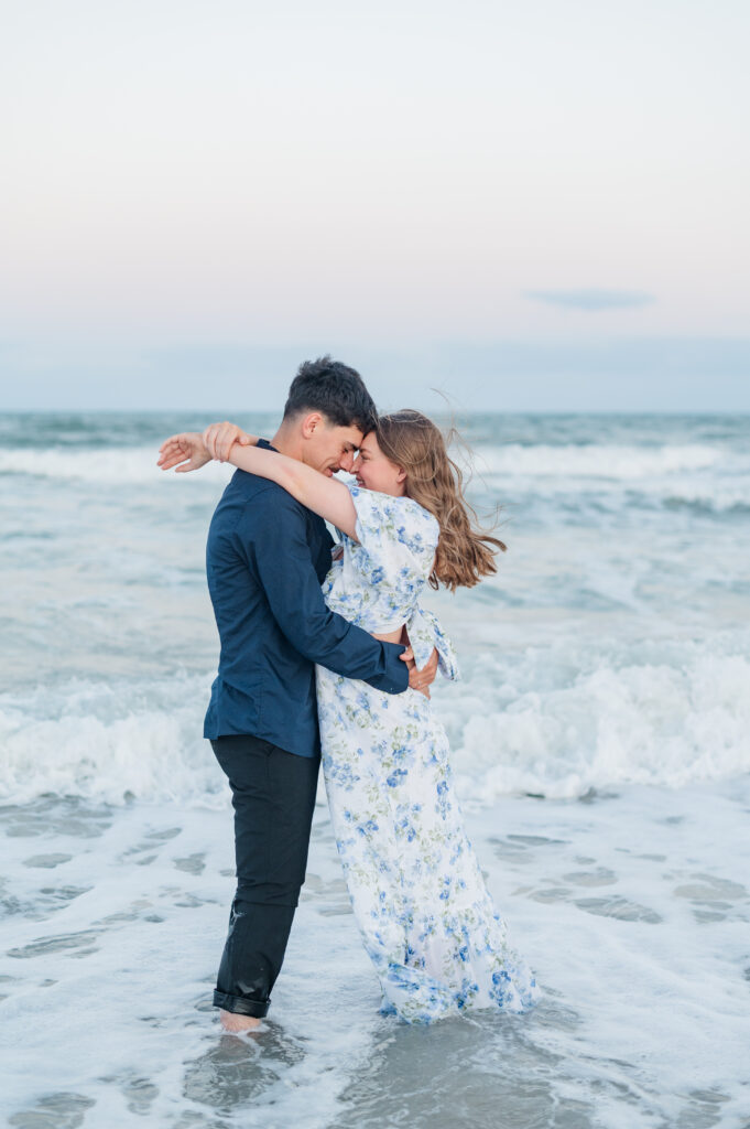 couple with foreheads touching at topsail beach