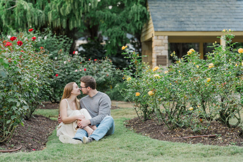 Raleigh rose garden engagement session couple sitting