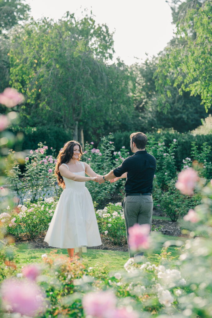reynolda gardens engagement session couple dancing