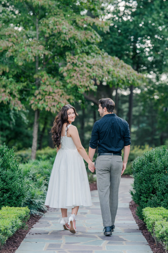 reynolda gardens engagement session couple walking