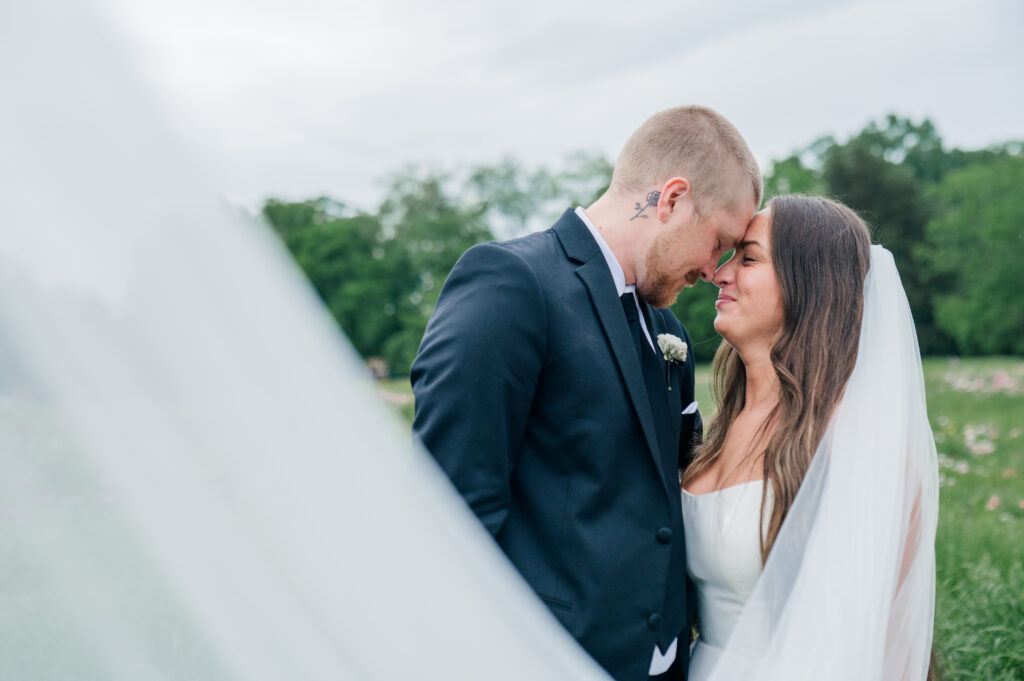 Bride and groom portraits veil