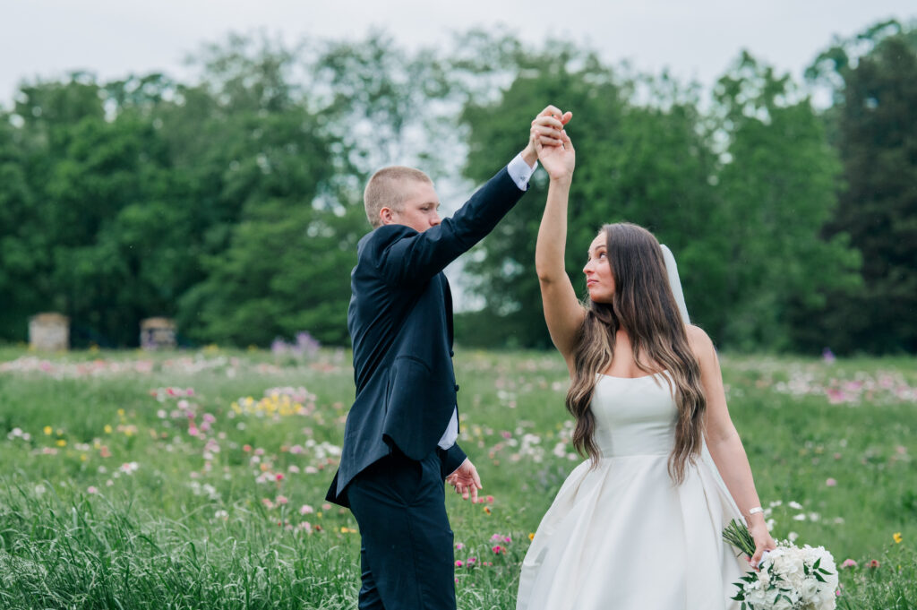 Bride and groom portraits flower field rainy