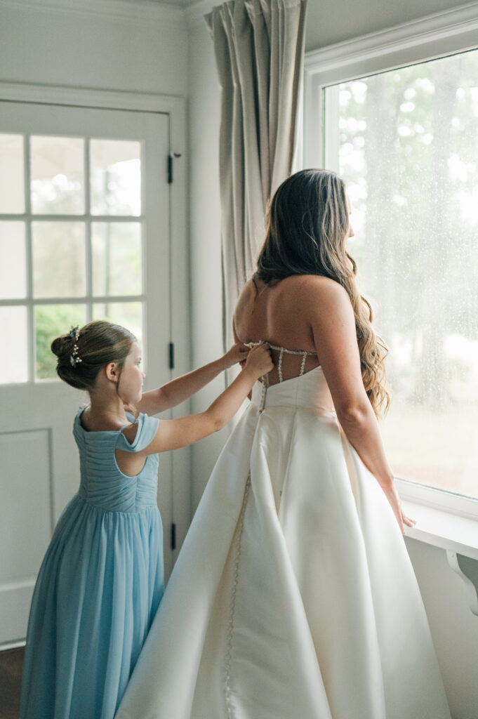 Bride and flower girl getting ready